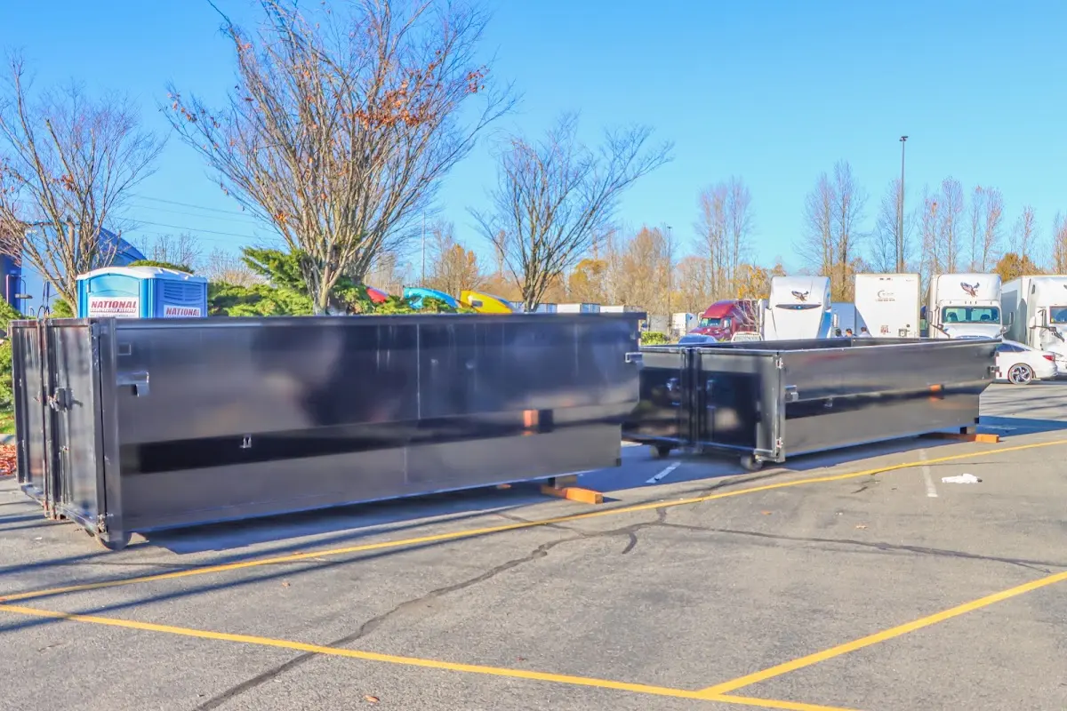 Professional dumpster rental service with roll-off container on residential driveway in Samsula-Spruce Creek